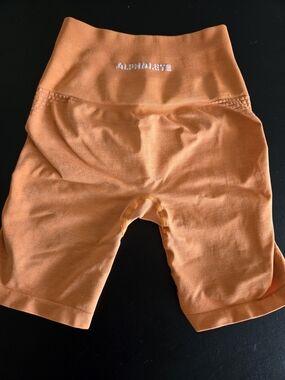 ​Alphalete Amplify Seamless High Rise Biker Shorts Orange Small